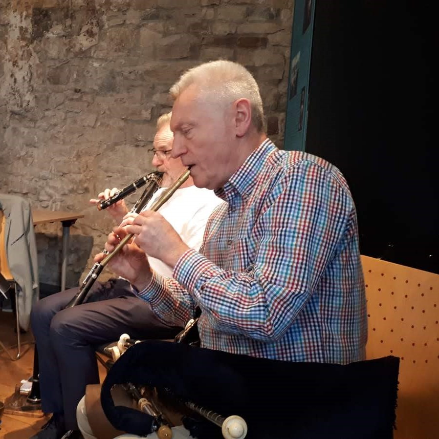 Paul Roe playing two clarinets at once and Mick O'Brien playing the whistle